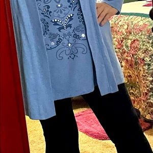 Women’s long sleeve tunic top with attached vest.